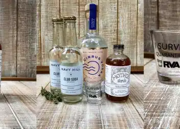 bottles of alcohol with shot glasses